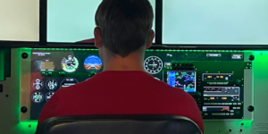 Image of a student in High Flight Academy's Redbird FMX flight simulator which is part of their flight simulator program.